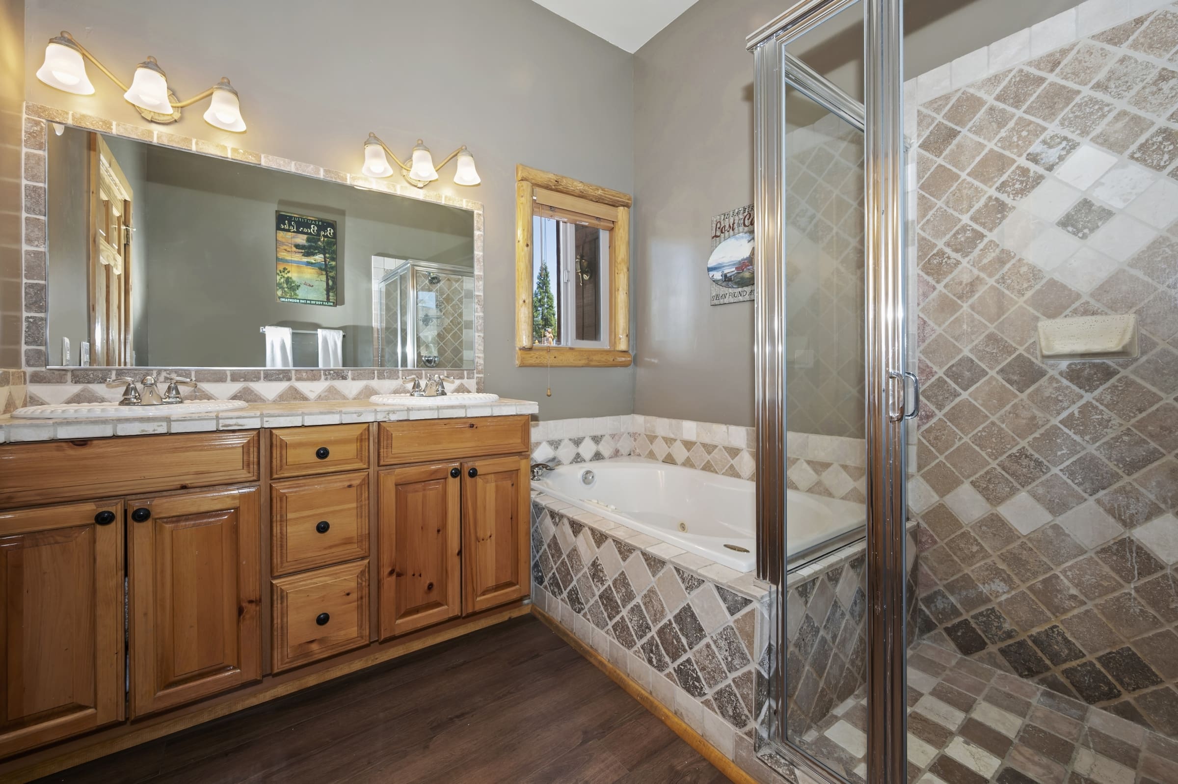 Dual-vanity bath with soaking tub and tiled walk-in shower