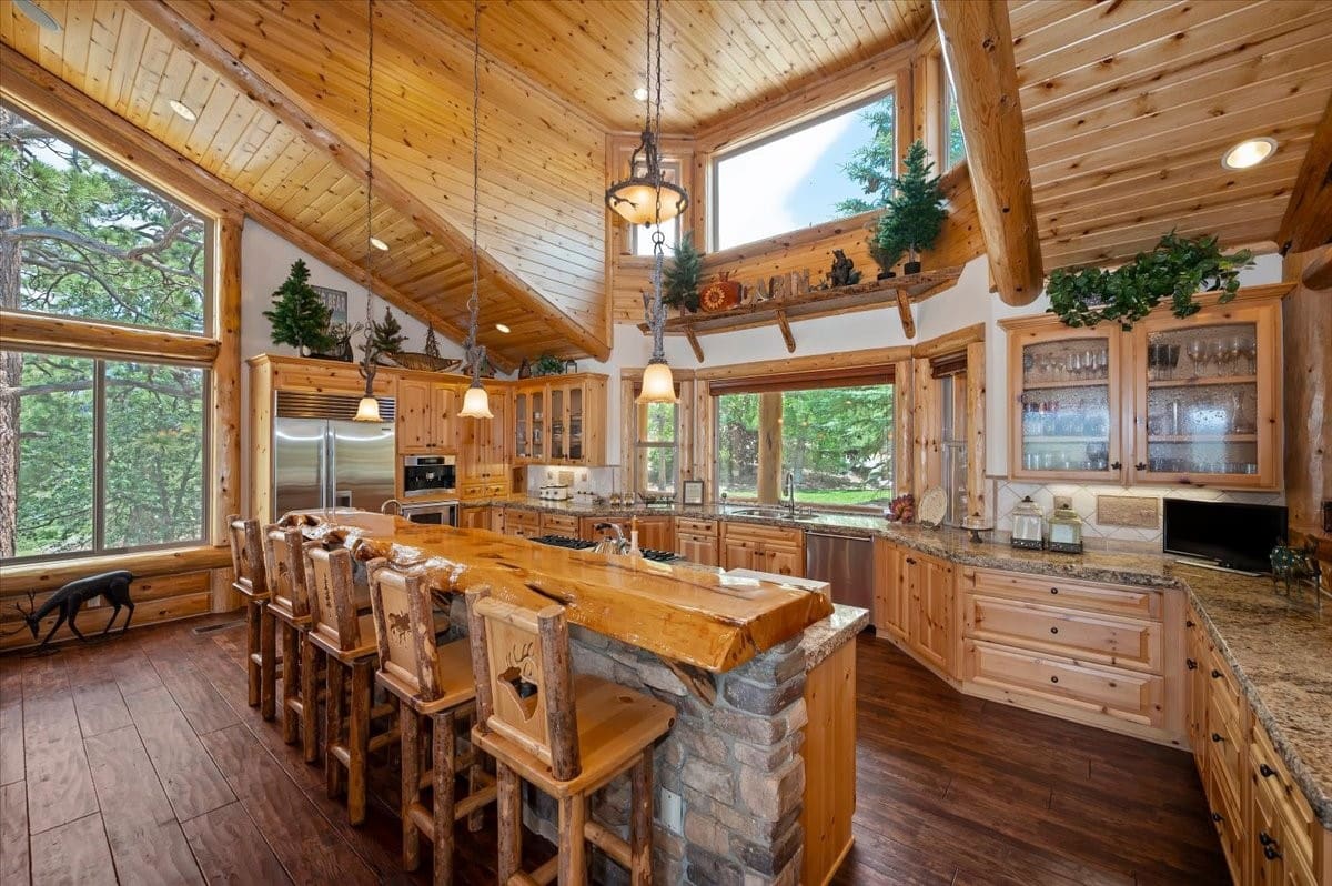 Vaulted log kitchen with live-edge slab bar seating