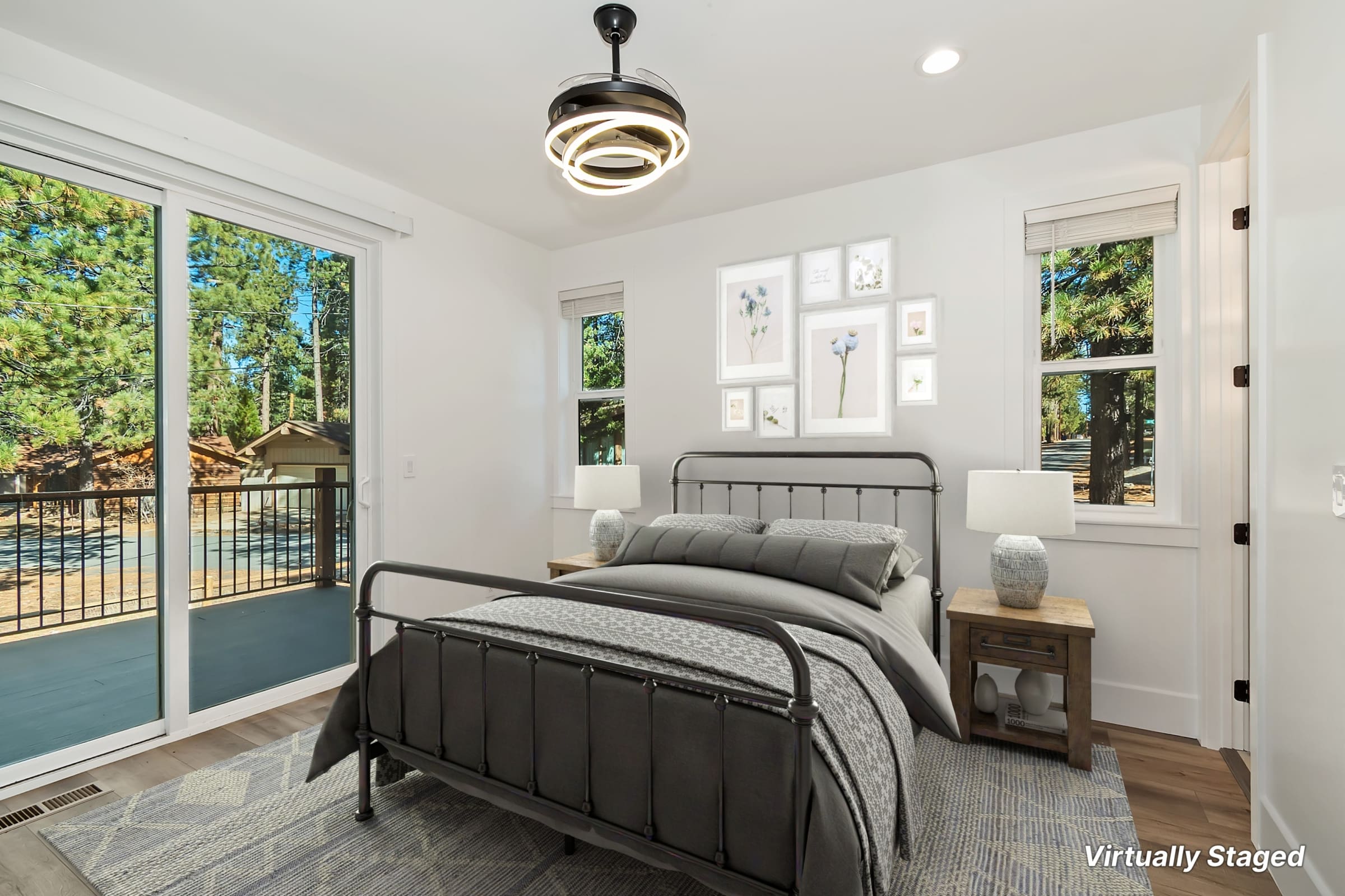 Bedroom with private deck access and wooded views