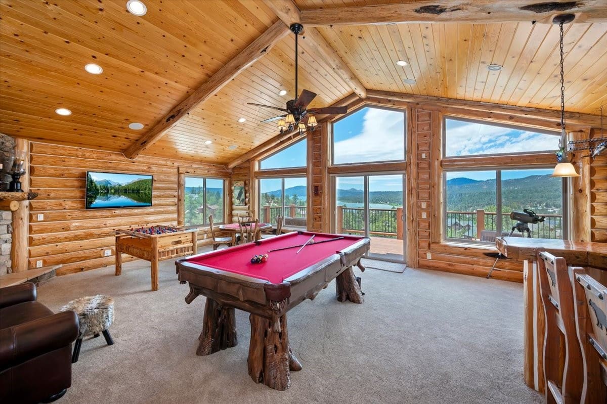 Log cabin game room with pool table and mountain views