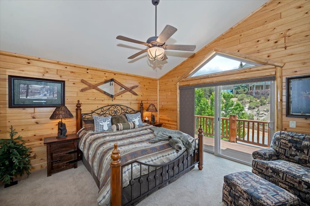 Log cabin master suite with private deck access