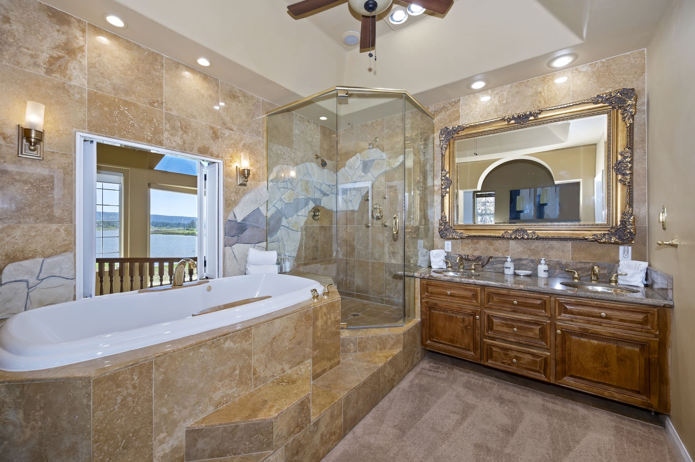 Soaking tub with private balcony water views