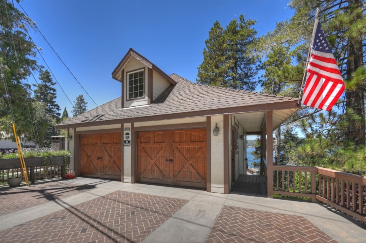 Charming two-car garage with lake views beyond