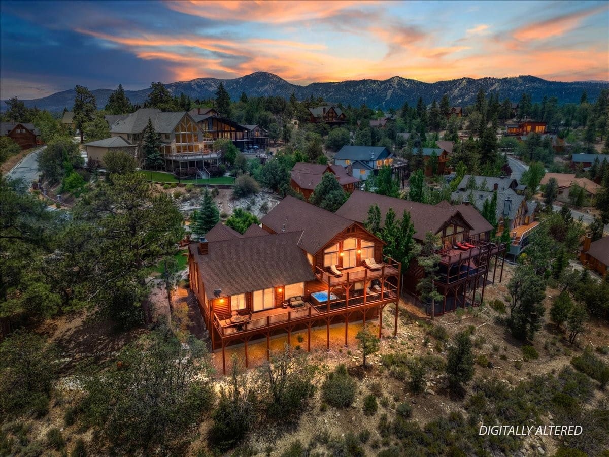Twilight aerial view, mountain cabin retreat with private deck